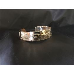 Patrick Seaweed Split Eagle Gold Bracelet , Donated by:  Friend of DEWC Appraised Value: $2000