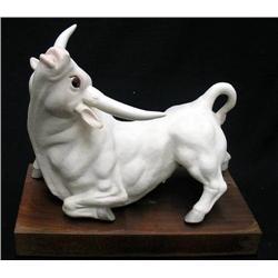 Cybis bull figurine on attached wooden 