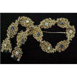 18k gold diamond and sapphire pin; bow 