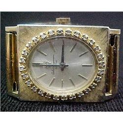 Man's 14k gold Longines wristwatch; bez