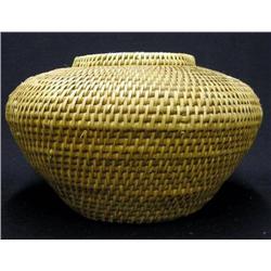 Coiled basket in vessel form; early 20t