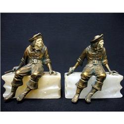 A pair of spelter figural bookends on a