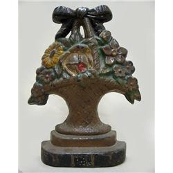 Cast iron flower basket doorstop; origi