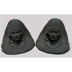 A pair of cast iron American Indian Chi