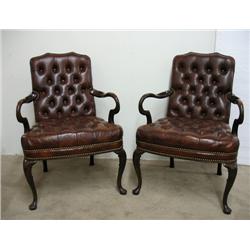 A pair of walnut and brown leather upho