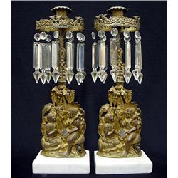 A pair of Empire brass girandoles on ma