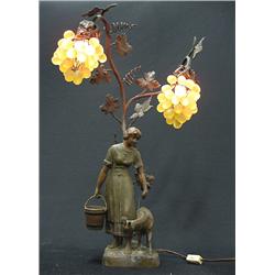 Spelter newel post lamp; woman holding 