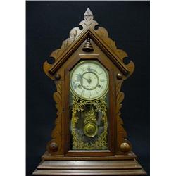 Walnut cased gingerbread shelf clock by