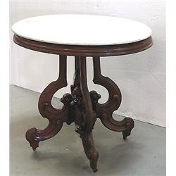 Walnut Renaissance Revival oval table; 