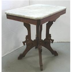 Walnut Victorian marble top table; beve