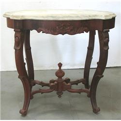 Walnut Victorian center table; beveled 