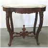 Image 1 : Walnut Victorian center table; beveled 