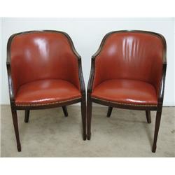 A pair of mahogany and leather upholste