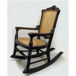 Walnut Victorian child's rocker; carved