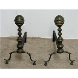 A pair of brass andirons; turned standa
