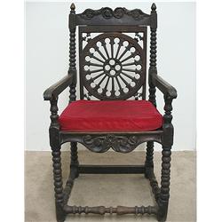 Continental oak armchair; scalloped cre
