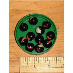 11 old black marbles with orange and/or white   -11 billes noires vieilles avec orange et/ ou blanc