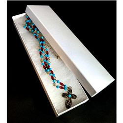 Designer beaded necklace with cross.