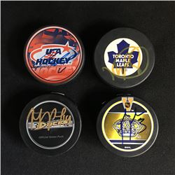 4 SIGNED NHL HOCKEY PUCKS (BABCOCK, SCHNEIDER,LUPAL JOHNSON)