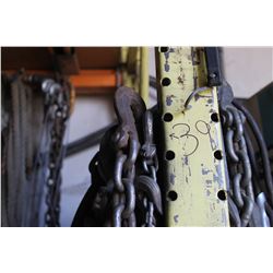QUANTITY OF CHAINS, SHACKLES, ROPE & CORDS HANGING ON THE WALL