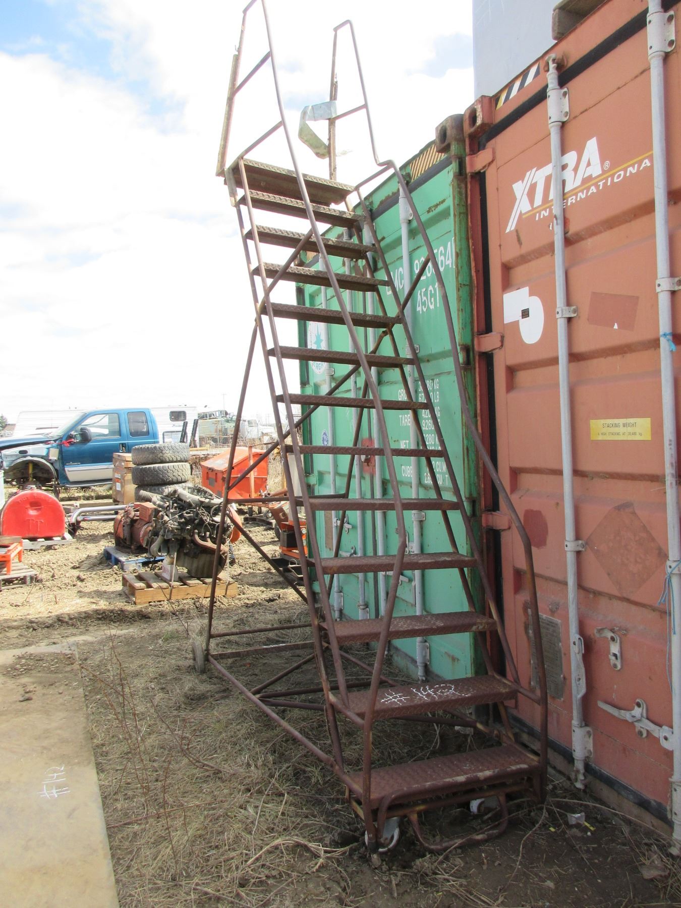 APPROX. 10' ROLLING LADDER (BENT A BIT), 4 LARGE GREEN TARPS & STEEL PLATE