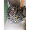 Image 2 : PILE OF EXTENSION CORDS & HOSE IN CORNER
