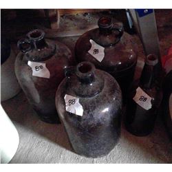 4 Brown glass Jugs