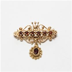 Lady's Antique 14K Yellow Gold Garnet Brooch.  Length of the brooch measures just over 1  long by 1 