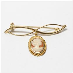 Lady's Edwardian 9K Yellow Gold Cameo Brooch.  Length of the brooch measures 1  long by just under 2