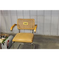 APPROX. 11 BROWN WICKER BACK ARM CHAIRS (ALL FOR ONE MONEY)