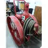 Image 2 : ANTIQUE ANSUL FIRE EXTIGUISHER ON CAST WHEELS WITH HOSE