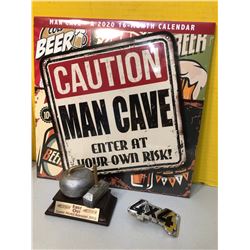 MAN CAVE CALENDAR AND FIRST OUT 2002 BONSPIEL TROPHY