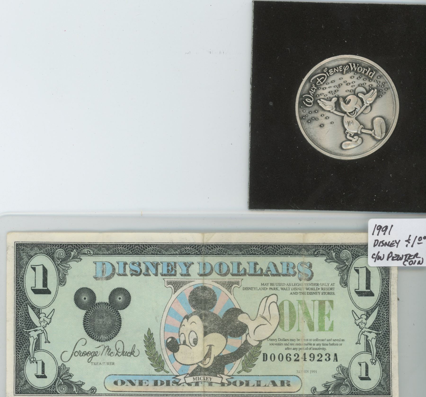 1991 DISNEY DOLLAR COMES WITH PEWTER COIN Schmalz Auctions 1991-disney-dollar-comes-with-pewter-coin-schmalz-auctions