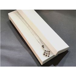 Contemporary silver necklace with grape like cluster motif.