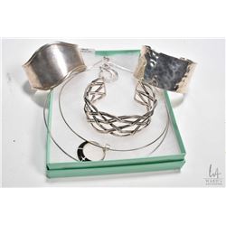 Selection of sterling silver jewellery including three cuff bracelets and two choker style necklaces