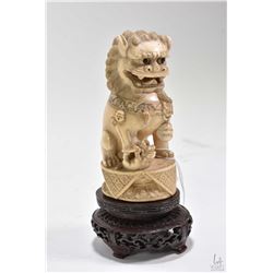Antique ivory foo dog 6" in height including carved rosewood plinth