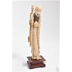 Antique ivory figure of Shou Lao ( The god of Lengevity" on rosewood plinth 11" in height
