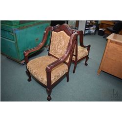 Set of his and hers wood framed arm chairs with damask style upholstery