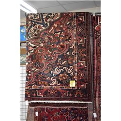 100% handmade Iranian Bakhtyar carpet with center medallion, overall floral design in tones of red, 