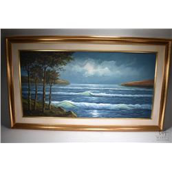 Gilt framed oil on canvas painting of a shoreline with breaking waves signed by artist 24" X 48"