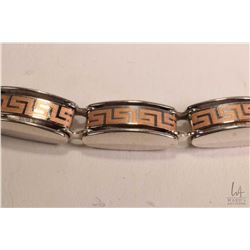 10kt white gold bracelet set with rose gold Greek key designed links