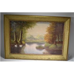 Framed oil on canvas painting of swans on an autumn lake signed by artist F.R. Meyer, 19" X 31"