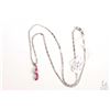 Image 2 : 10kt white gold 16" neck chain and a 14kt white gold pendant set with three marquise cut rubies and 