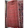 Image 1 : Small 100% handmade scatter rug with red background and highlights of copper, black and cream, 50" X