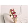 Image 1 : 14kt white gold, ruby and diamond ring set with .36cts of baguette cut ruby gemstones and .32cts of 