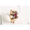 Image 1 : 14kt yellow gold ruby and diamond ring set with .15ct round mixed cut ruby gemstone and four 0.25ct 