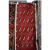 Image 1 : Small 100% handmade scatter rug with red background, black, cream and taupe highlights, 17" X 38"