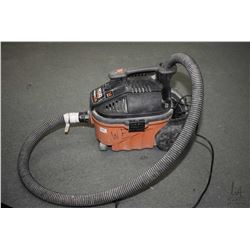 Rigid 4 gallon, 5 hsp portable vaccum, working at time of cataloguing plus a set of support brackets