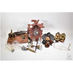 Selection of collectibles including Edison bulbs, miner's lamps, glass and metal door knobs, telegra