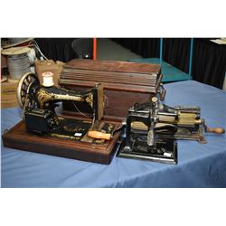 Vintage Singer electric sewing machine in portable wooden case, serial no. M181611, note missing pow